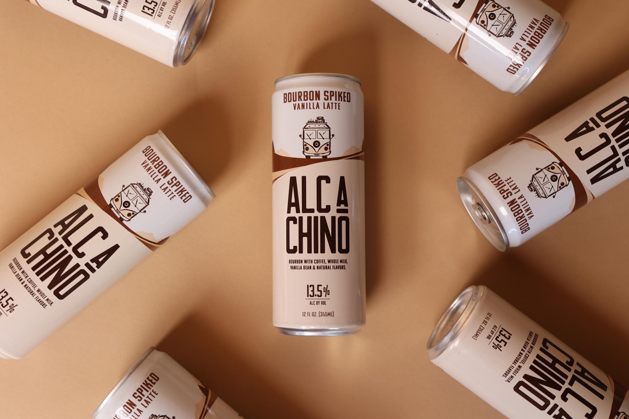 AlcaChino cans scattered across a tan backdrop