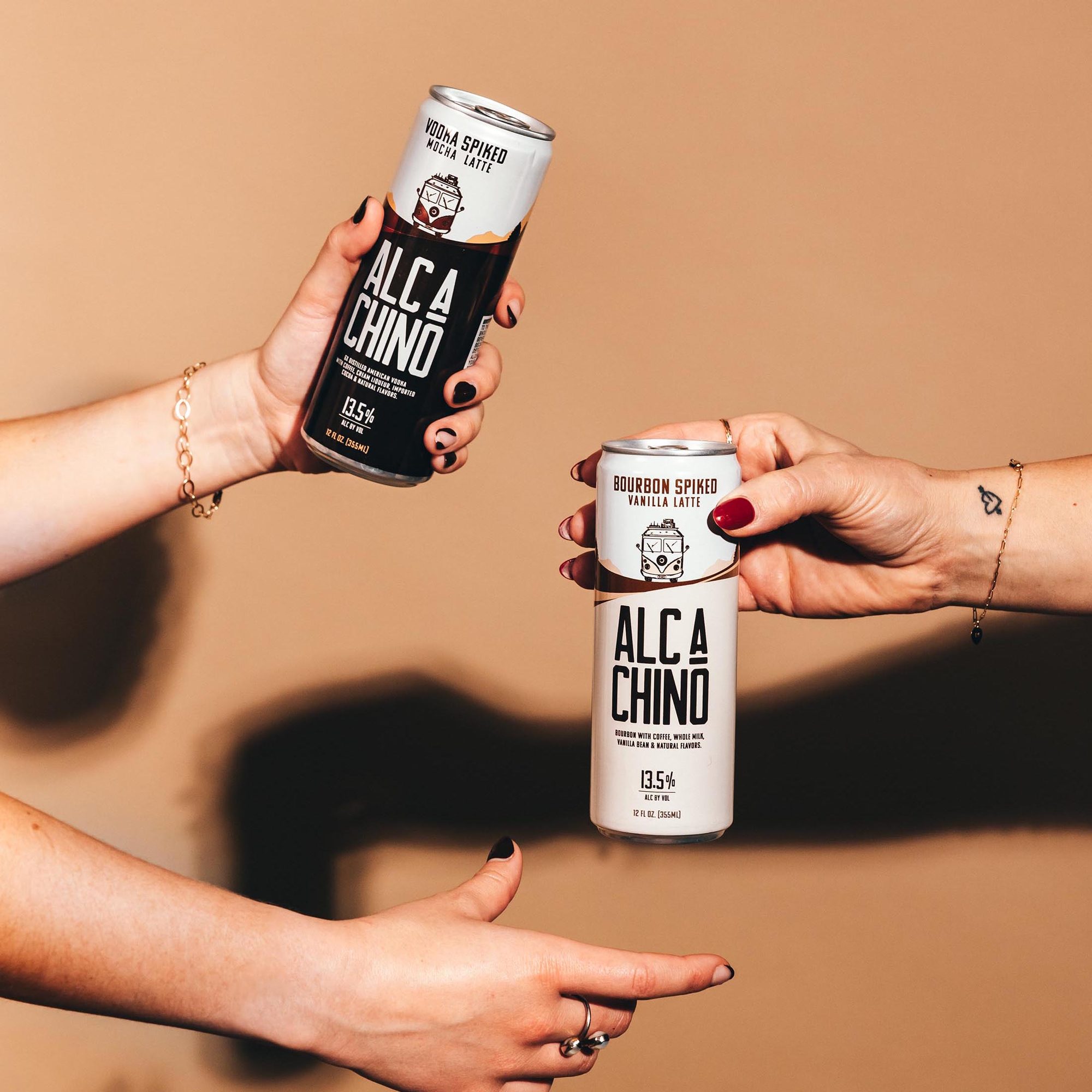 Two hands passing AlcaChino cans
