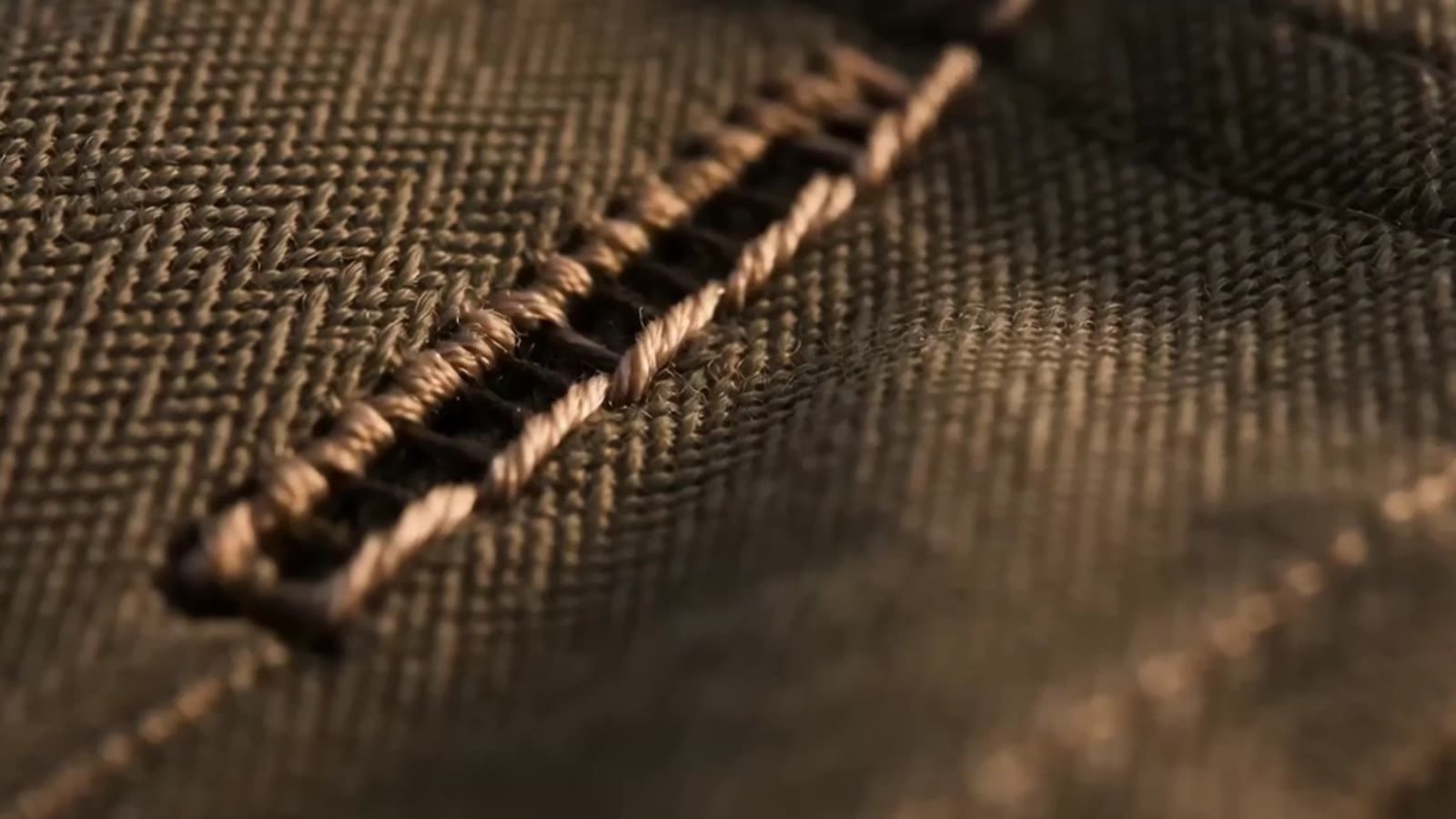 Macro of saddle stitching on canvas