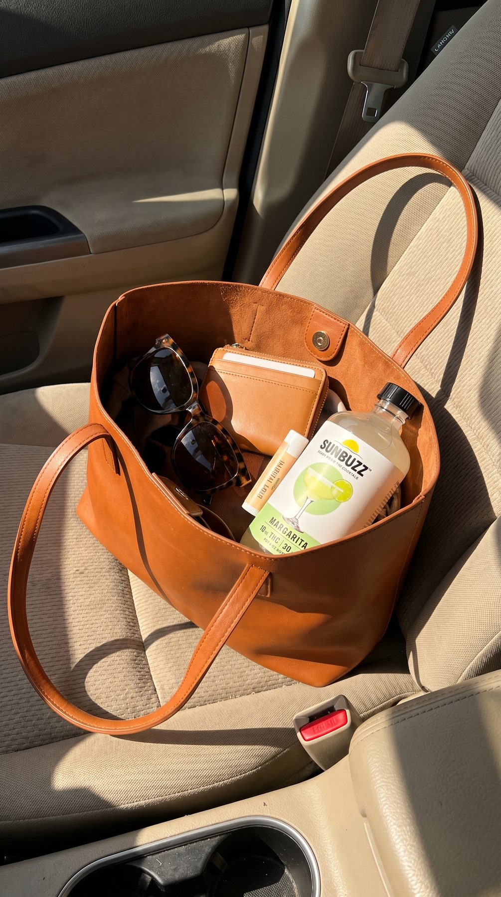SunBuzz bottle in a tote bag on a car seat
